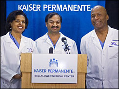 Doctors Karen Maples, left with Harold Henry, right and Mandhir Gupta center take questions at a news conference at the Kaiser Permanente Bellflower Medical Center in Bellflower, Calif. on Jan. 26, 2009. 