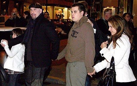 John Travolta with wife Kelly Preston enjoy a night out in Paris with their children Jett and Ella Bleu